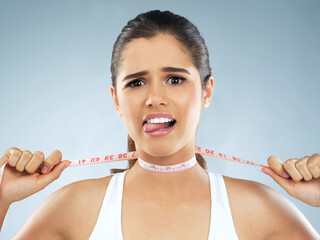 Portrait, woman and tape measure on neck for mental health, eating disorder and body dysmorphia....