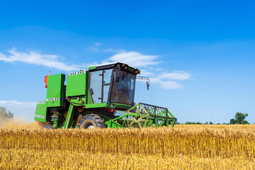 combine harvester working on a wheat field