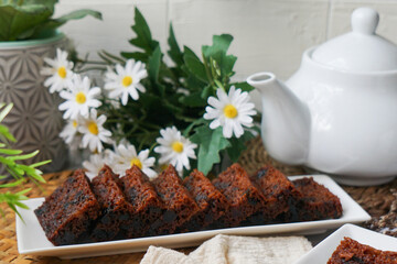 Kek Buah Kukus, a traditional Malaysian steamed fruit cake filled with dried fruits, nuts, and spices