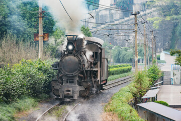 Steam narrow-gauge locomotive approaches to the station. Jiayang Mining Region. Sichuan province.