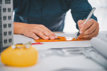 engineer working in office with blueprints, inspection in workplace for architectural plan, construction project ,Business construction