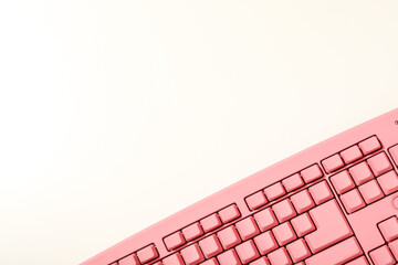 Pink computer keyboard on a white background