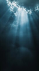 Sun rays breaking through dark clouds in the sky