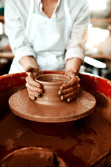 Hands, process and pottery in workshop for creativity, art deco and development for startup. Clay, artistic person and career or talent in small business with production for project and sculpture