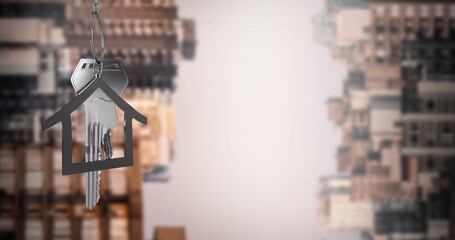 Image of silver house key  over cityscape