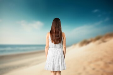 Shot of beautiful happy young woman on the beach