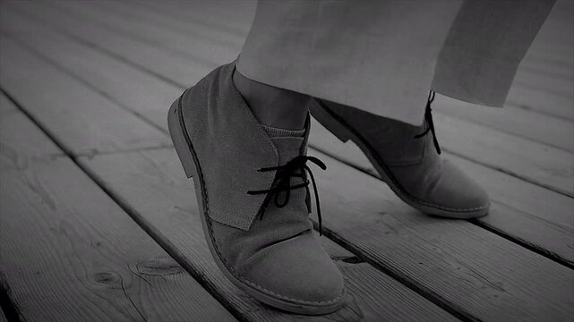 Stylish shoes on a wooden deck, appealing to fashion enthusiasts with an outdoor theme