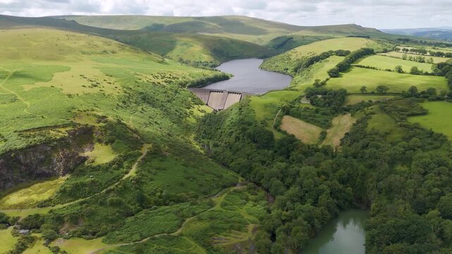 Aerial establishing shot of Meldon Reservoir within Dartmoor National Park, showcasing expansive natural beauty
