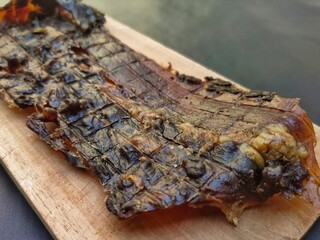 Deer jerky made from dried and spiced deer meat, known for its unique, savory flavor and chewy texture. 