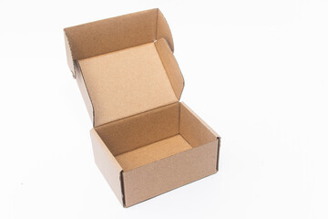 An open cardboard box with a simple, sturdy design. Ideal for packaging, storing, or shipping small items. The clean and minimalistic look adds to its versatility.