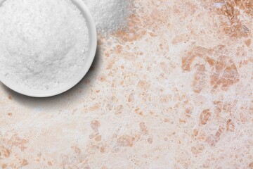 Salt shaker white spilled salt pile on desk