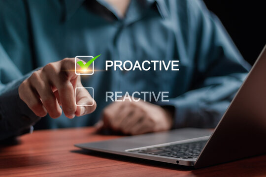 Proactive or reactive solution initiative concept. Businessman tick a checkbox with the text proactive.