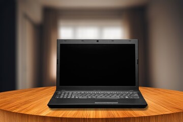 Laptop Computer with blank screen on the desk