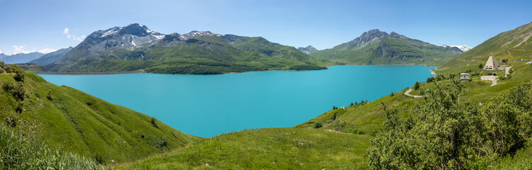 Amazing view of the Mont-Cenis Lake an alpine artificial lake. French Alps. Summer time. Relaxing and green contest. Turquoise water