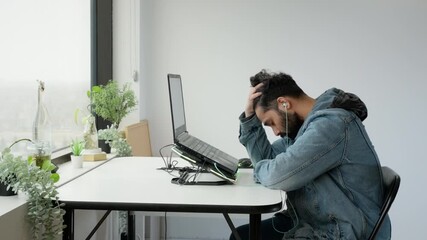 Young Middle Eastern Man Working at Desk Laptop Looking Stressed Frustrated and Hopeless