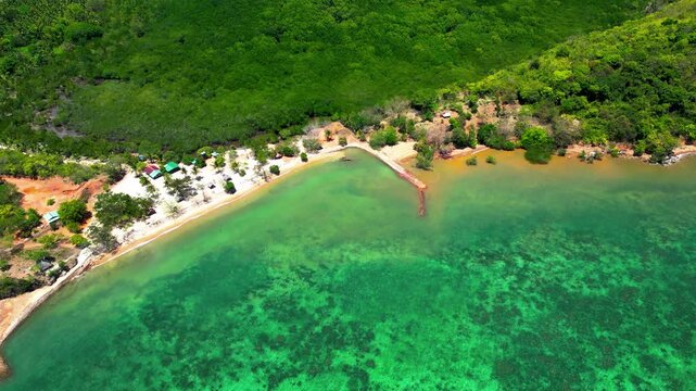 Cabo Beach Drone Aerial Descend Above Coron Sea Harbor On A Sunny Day