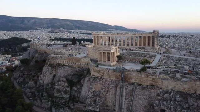 Aerial Revealing Tilt of Parthenon Monument, Acropolis of Athens Hill at Sunset, Greece