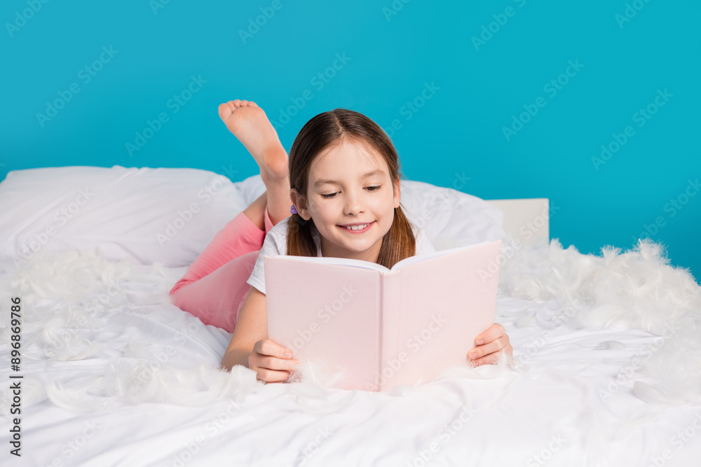 Sticker Photo of pretty lovely girl lying comfortable bed reading isolated on blue color background