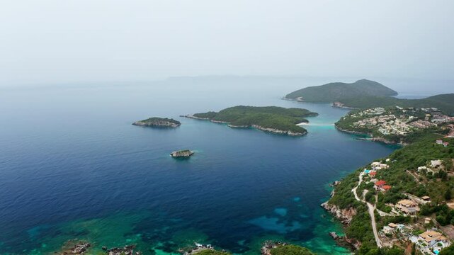 Aerial drone view of the Preveza coastline in the Epirus region in Greece. High view of the exotic Alonaki beach and other small beaches in the distance close to Parga.