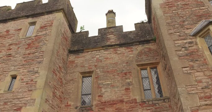 Ancient Brick Facade Exterior Of Bishop's Palace Residence In Wells, Somerset, England. Low Angle Shot