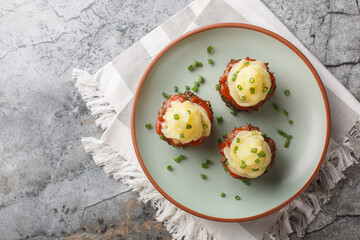 Beef Meatloaf muffins with tomato sauce and mashed potatoes close-up in a plate on the table. Idea...