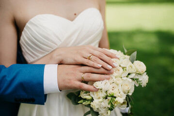 Hand in hand on a background of flowers
