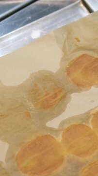 peel the profiterole off the parchment paper. profiterole baking failed. the profiterole broke. broken profiterole