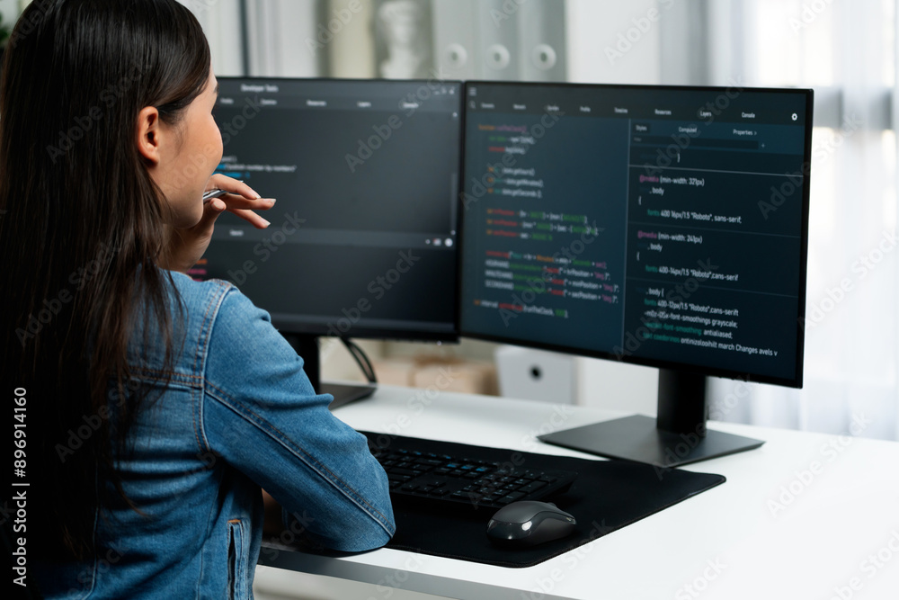 Poster young asian it developer looking online information on pc for beautiful pose with coding program dat