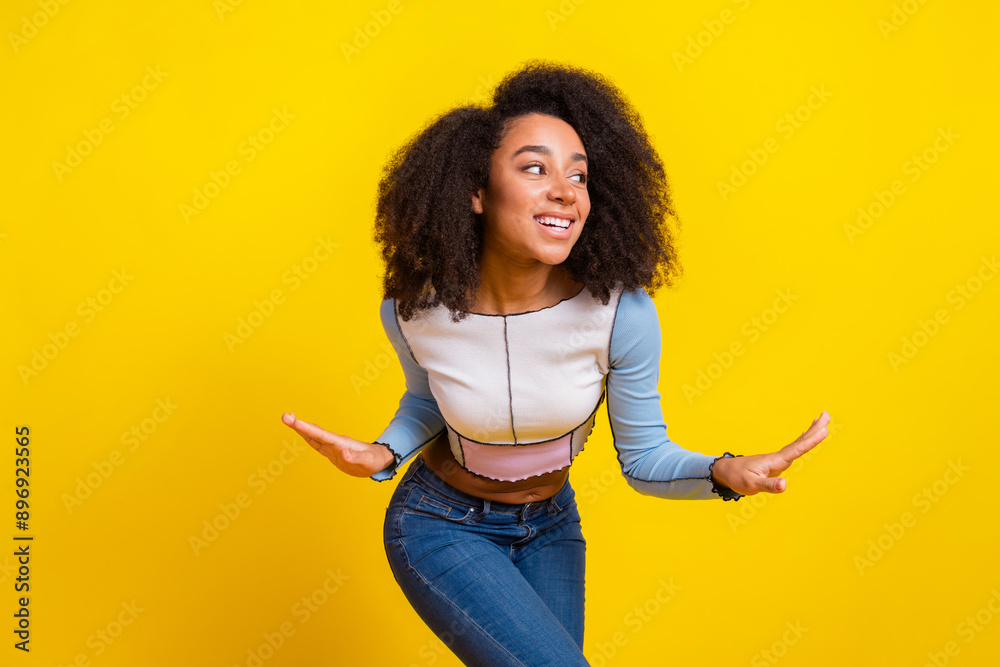 Sticker Photo portrait of attractive young woman dance good mood dressed stylish blue clothes isolated on yellow color background