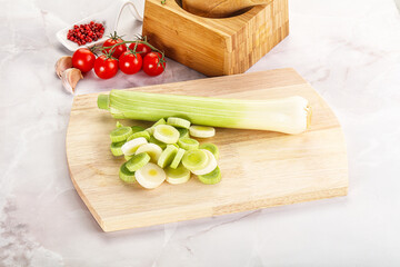 Ripe sliced leek over board