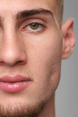 Obraz premium Close Up of Mans Face With Hazel Eyes