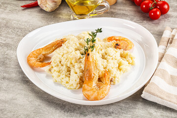 Italian risotto with prawn served thyme