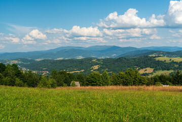 Beskid Zywiecki mountains from meadow bellow Tyniok hill summit in Beskid Slaski mountains in Poland