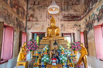 The old gold Buddha statue at Wat Ku, Nonthaburi, Thailand