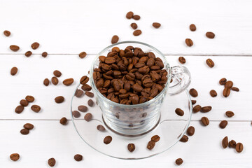 coffee beans and cup on a wooden background