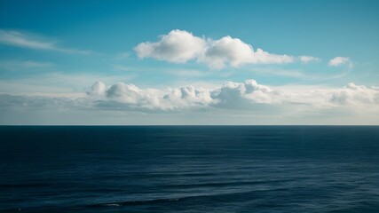 Fototapeta premium A vast blue sky dotted with soft, fluffy seemingly endless sea. Infinite space, ocean horizon
