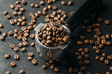 Horn with coffee beans on a dark background