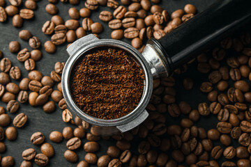 Horn with ground coffee on coffee beans