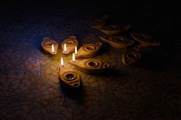 Oil lamps shining in the night, other lamps out of oil. 3d rendering illustration, parable of the wise and foolish virgins in Matthew 25.