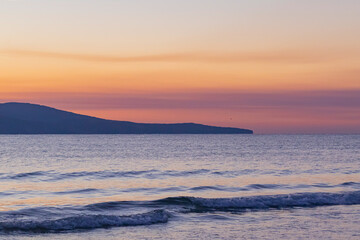 Fototapeta premium orange-purple sky over the sea after sunset
