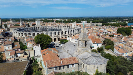 Obraz premium Roman amphitheater in Arles, a picturesque town located on the Rhone river in the Provence region, southern France. City rich in Roman history, attracts tourists traveling to admire european wonders.