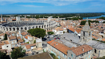 Obraz premium Roman amphitheater in Arles, a picturesque town located on the Rhone river in the Provence region, southern France. City rich in Roman history, attracts tourists traveling to admire european wonders.