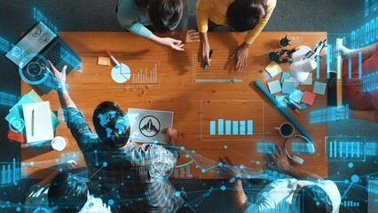 Top view of skilled business team put graphic logo on meeting table with colorful sticky notes and start to design while explain idea. Smart project manager explain about financial graph. Symposium.