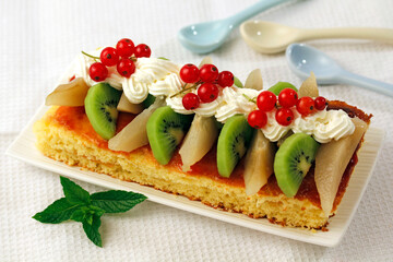 Sponge cake with jam and fruits.