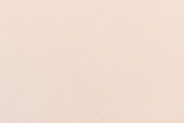 Fototapeta premium Texture of natural light pinkish beige fabric background, fabric texture