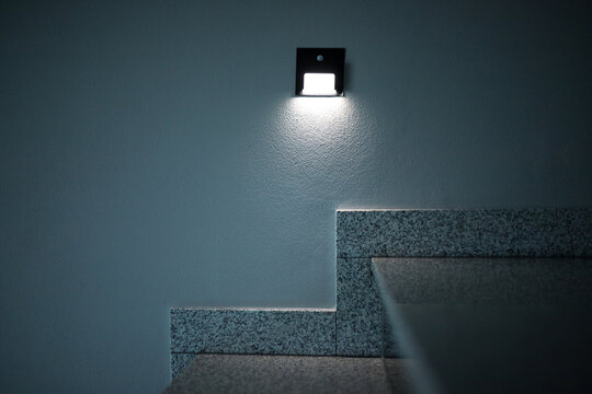Illumination of steps with lamps with motion sensors.  Illumination of the corridor with small bulbs.
