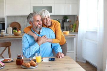 senior woman man couple happy retirement talking conversation chat love elderly coffee cup tea mug drink  old together adult female mature retired wife