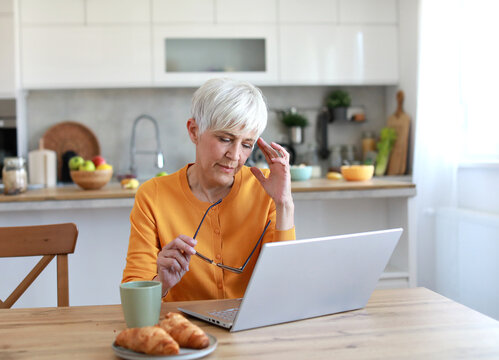 laptop woman business computer working office businesswoman home problem headache stress overworked pain tired frustration worried anxiety active aged senior