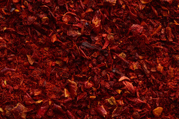 Red paprika powder texture. Background with copyspace. Top view