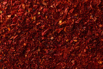 Red paprika powder texture. Background with copyspace. Top view